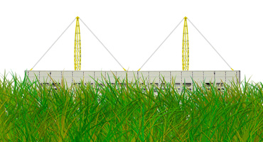 Çimlerin arkasında bir fabrika